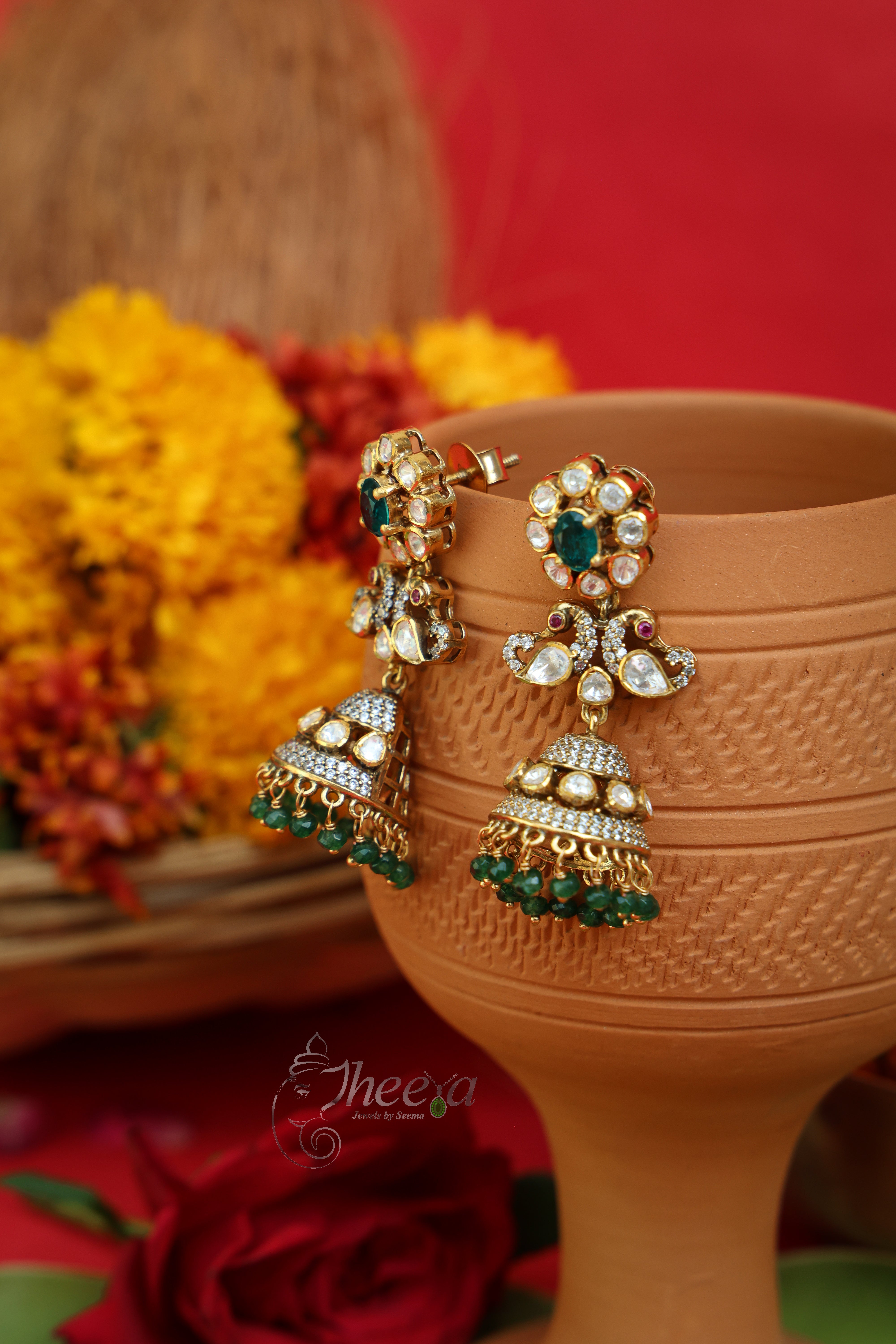 Close-up detailing of Sitara Bloom Green Flower Jhumkas highlighting Moissanite craftsmanship.